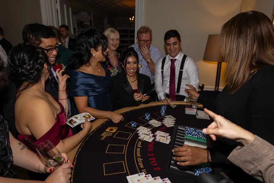Guests playing blackjack at the evening casino table