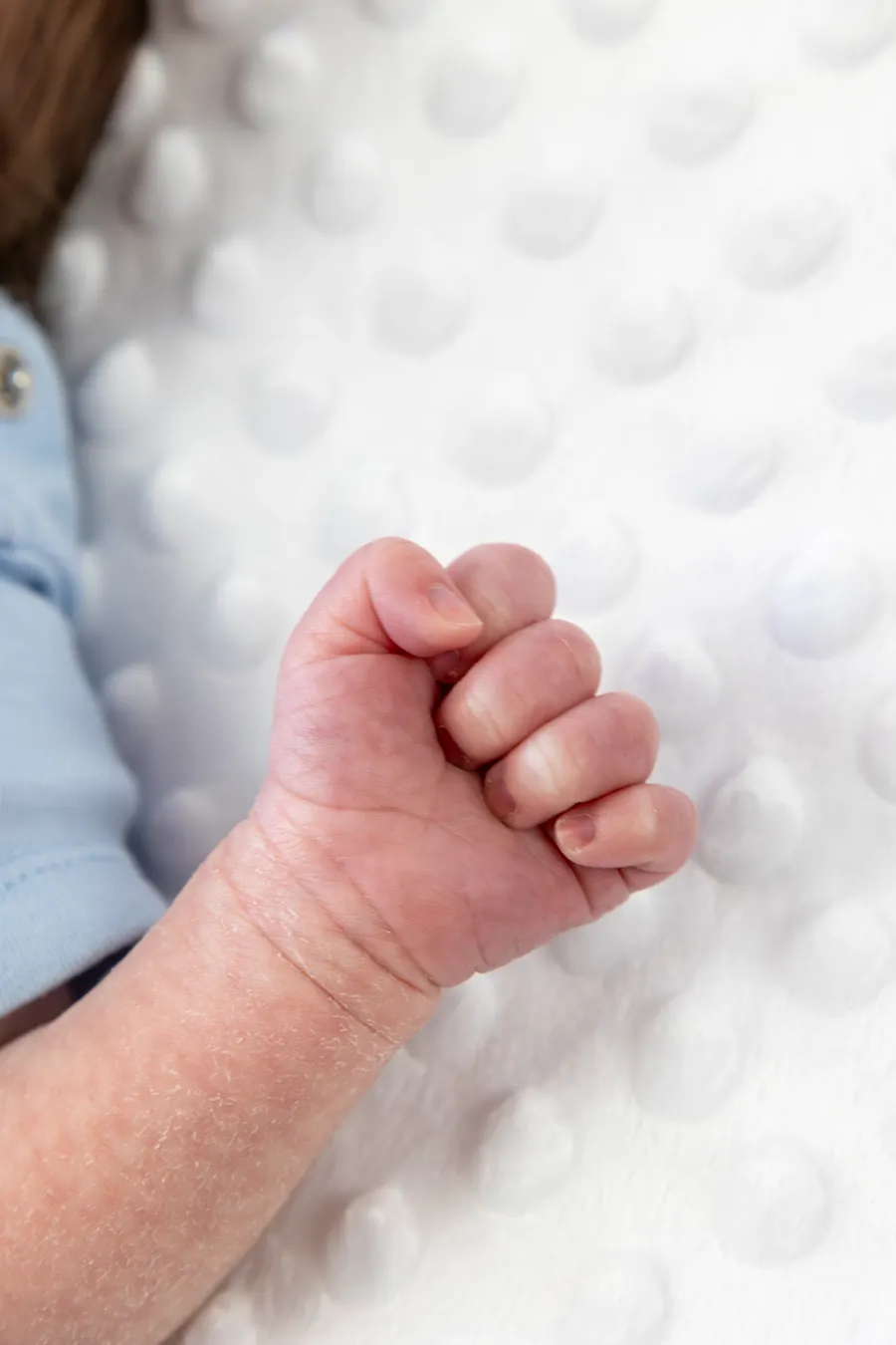 Close-up of a newborn's clenched fist