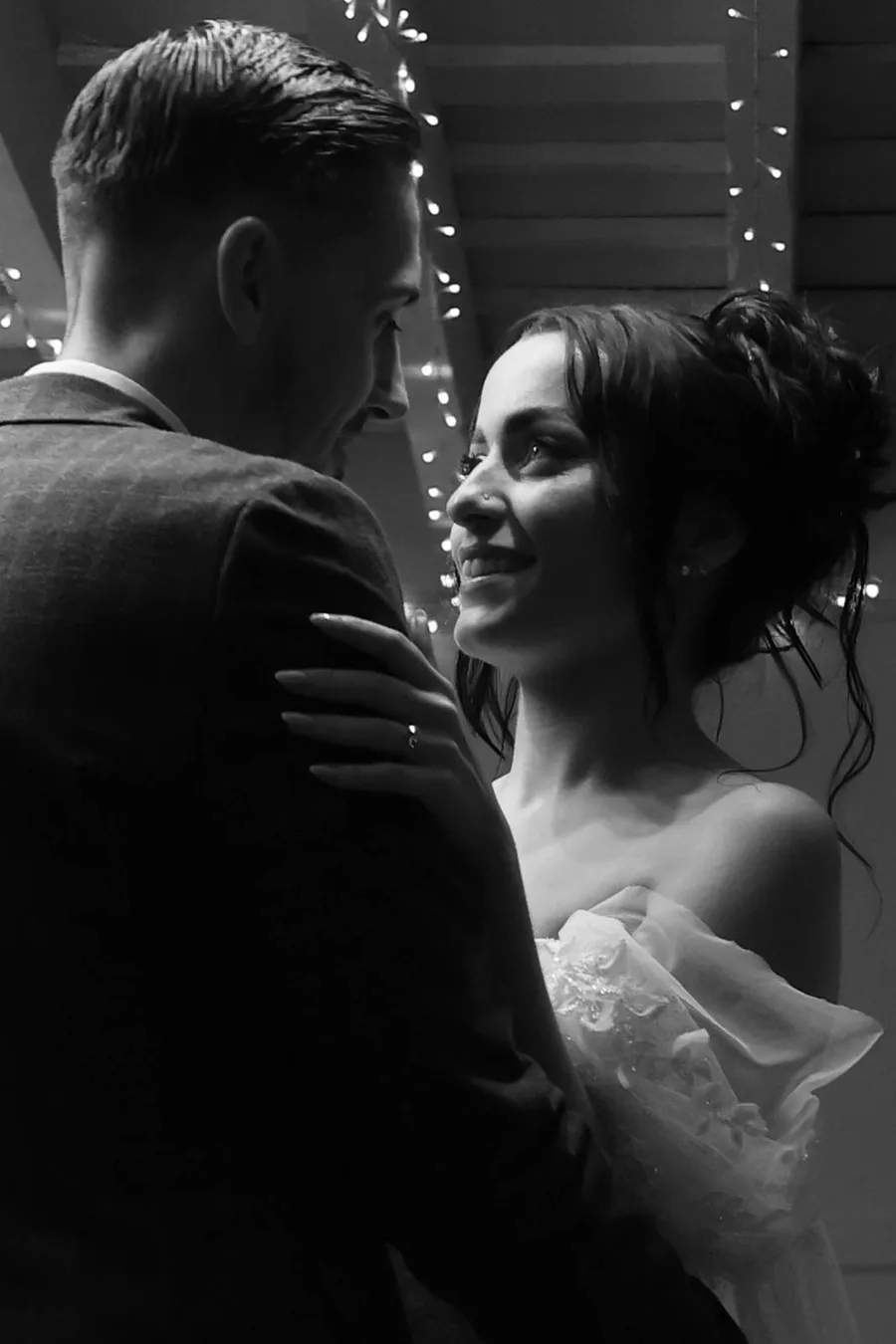 Bride and groom together in the evening light, in black and white