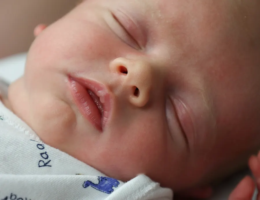 Close-up of a sleeping newborn's face