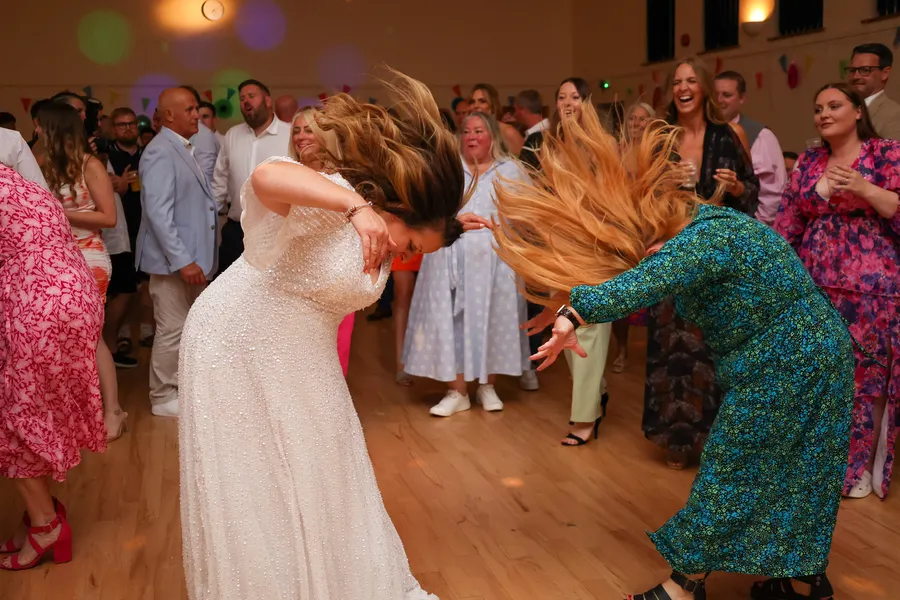 Guests dancing together at an evening party