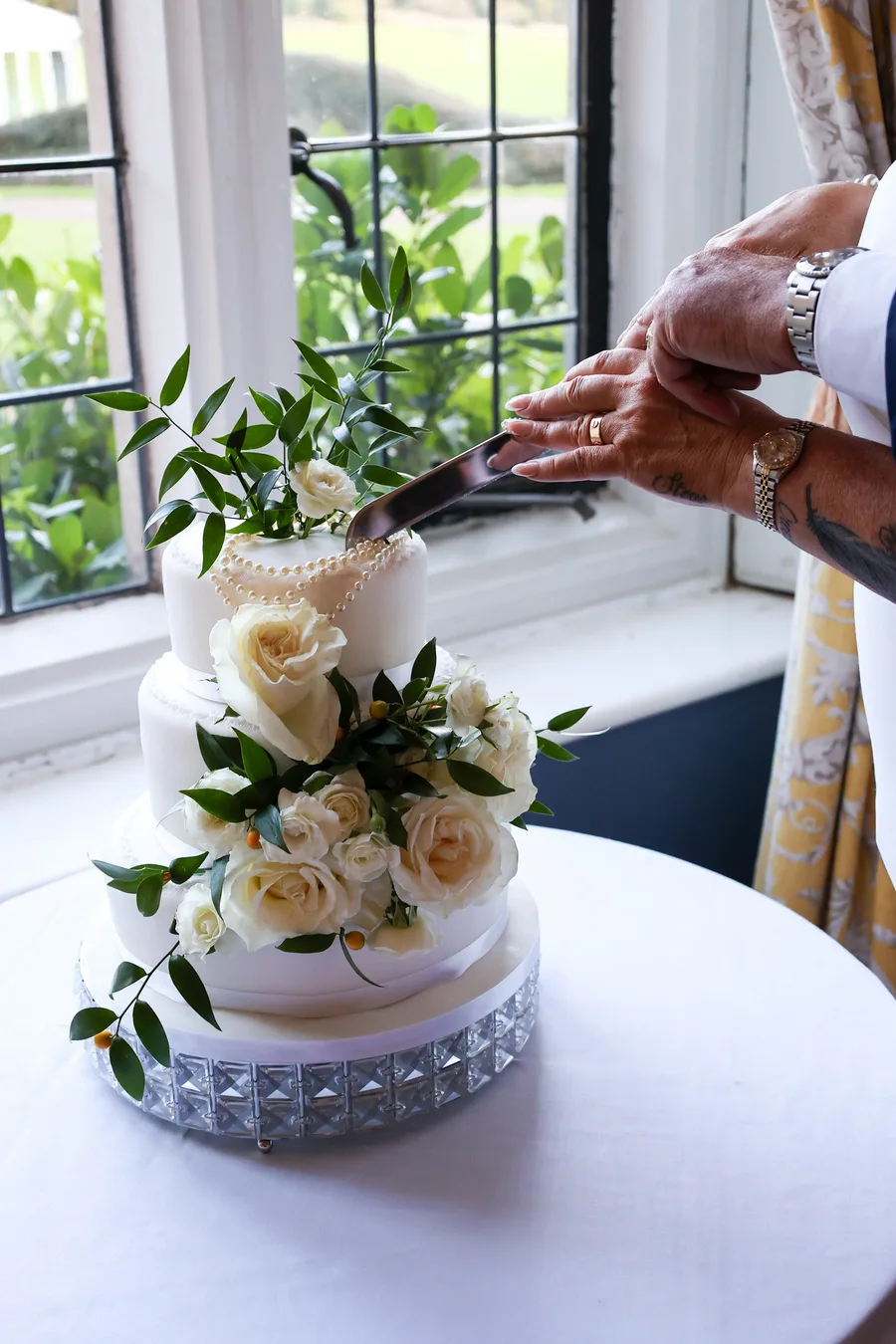 A sweet slice of love – the perfect wedding cake cutting moment in Kent.